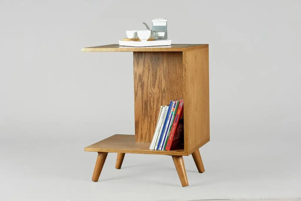 brown wooden table with books and mugs