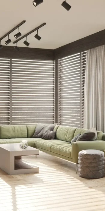 a living room with a green couch and a white coffee table